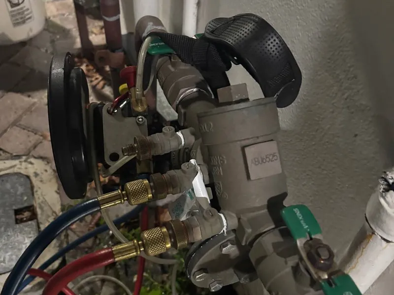 Backflow preventer under test with gauge hoses hooked up