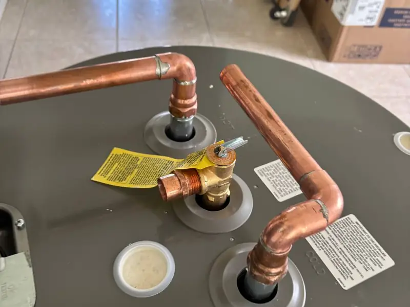 Water heater top with new copper and temperature-and-pressure relief piping
