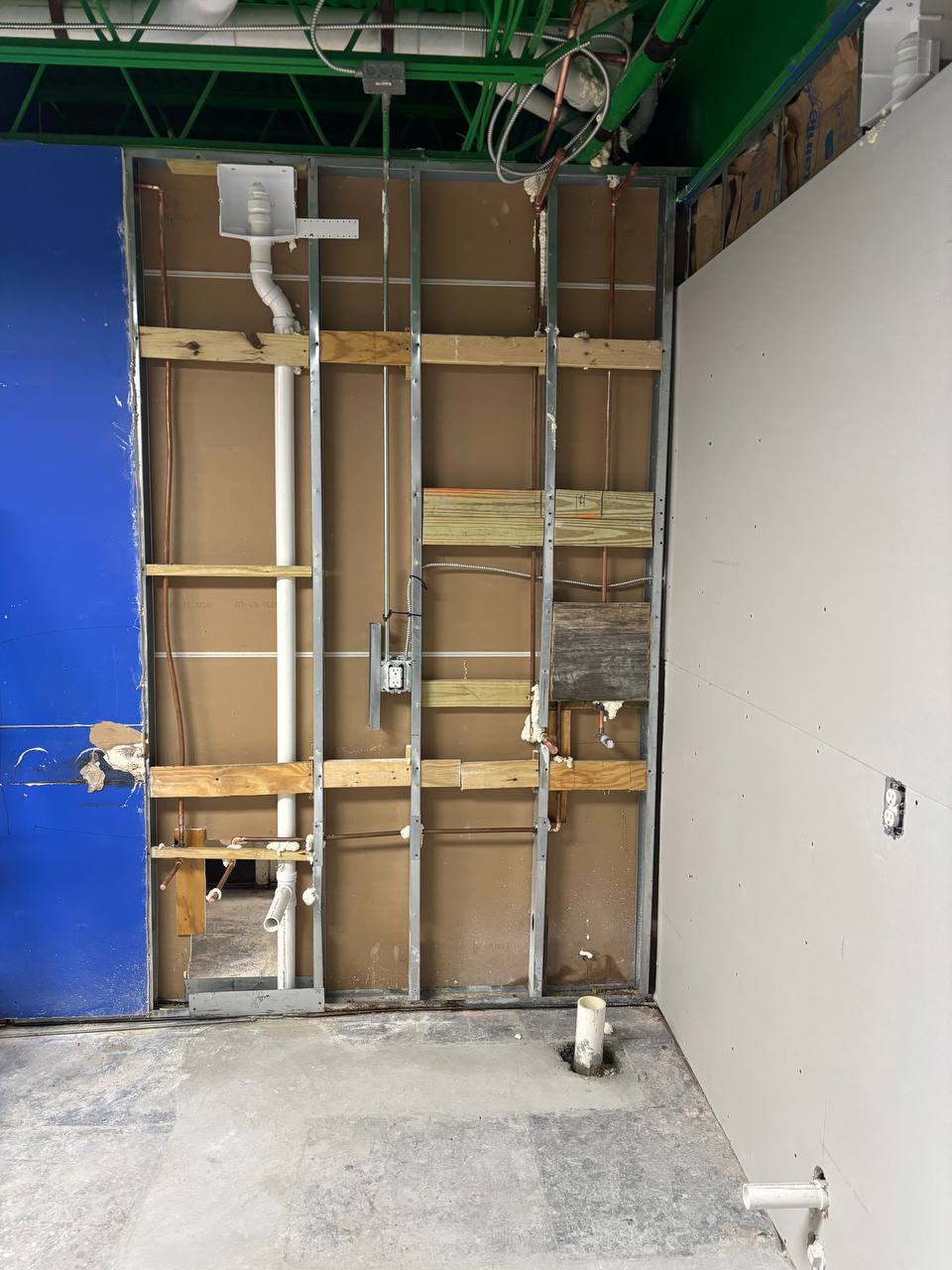 Commercial stud-wall drain, waste, vent, and copper supply rough-in