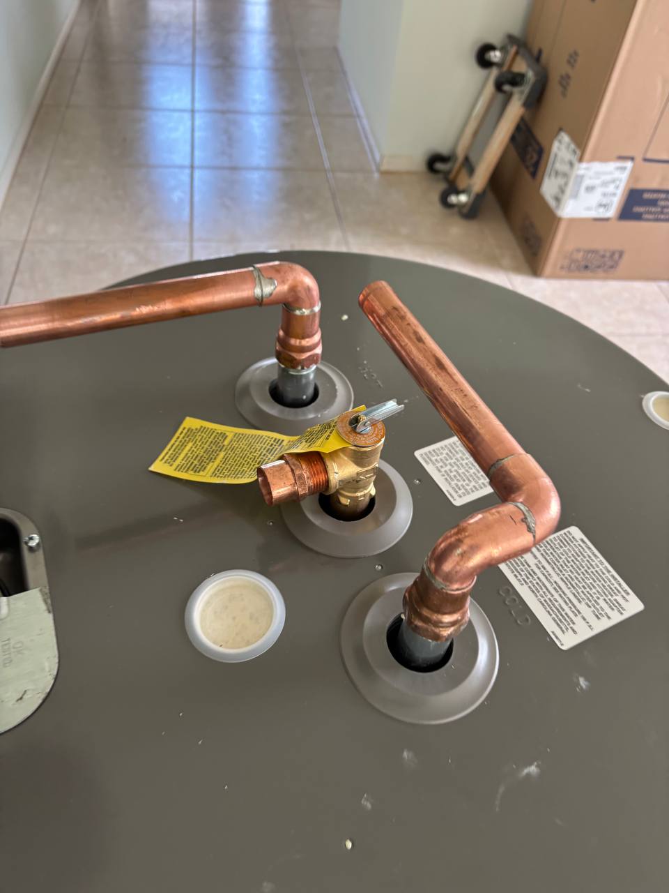 Water heater top with new copper and temperature-and-pressure relief piping